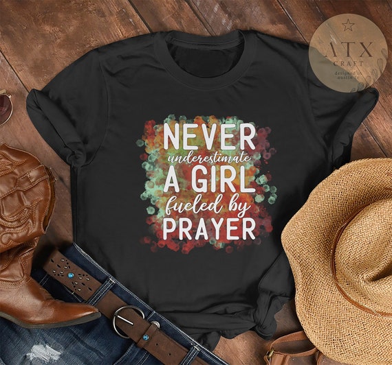 Never Underestimate A Girl Fueled By Prayer, etsy.me/3R6DkMl #religiousclothing #jesusshirt #christiant-shirt #inspirationaltee @etsymktgtool