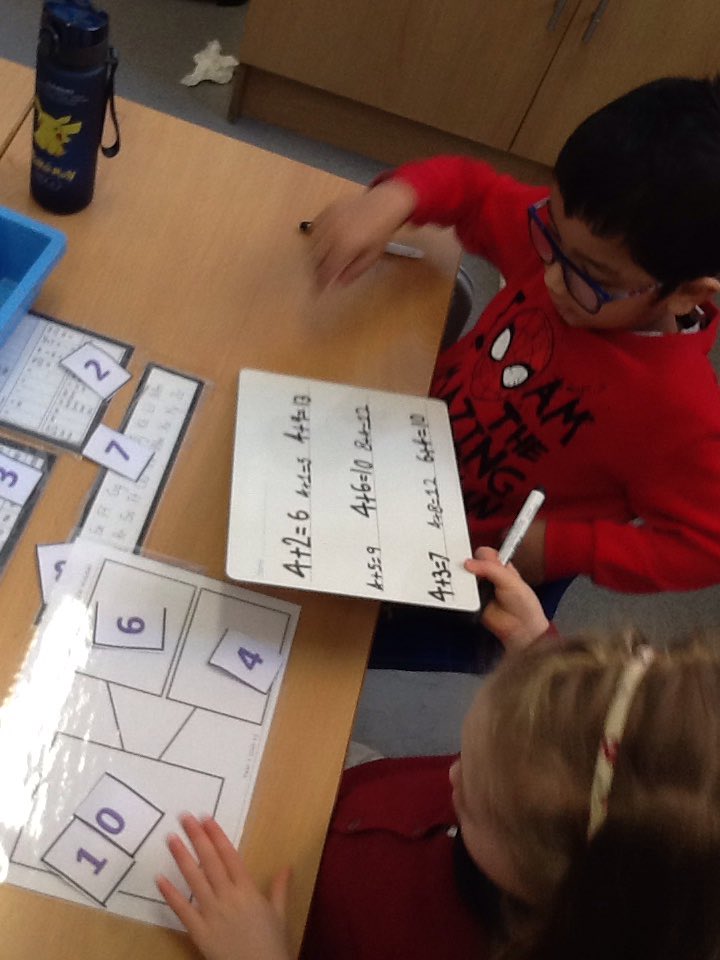 We were given a question and asked to investigate possible answers today. We took it in turns with our partners to try different numbers in the part whole model and write an addition sentence.