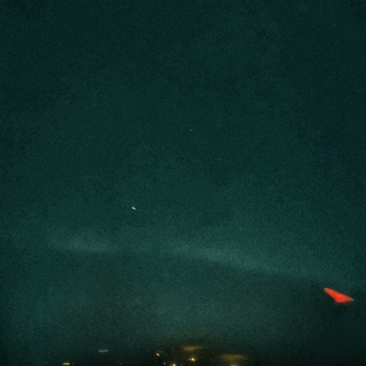 Ju1iaLund's tweet photo. As we took off from #Keflavic Airport, the #northernlights made a brief appearance. Very faint through the plane window. Tried a shot, but didn't show up. This is the best I could get with filters. Actual shot is second photo. #Iceland #Reykjavik #auroraborealis https://t.co/Rfb09XgMEQ