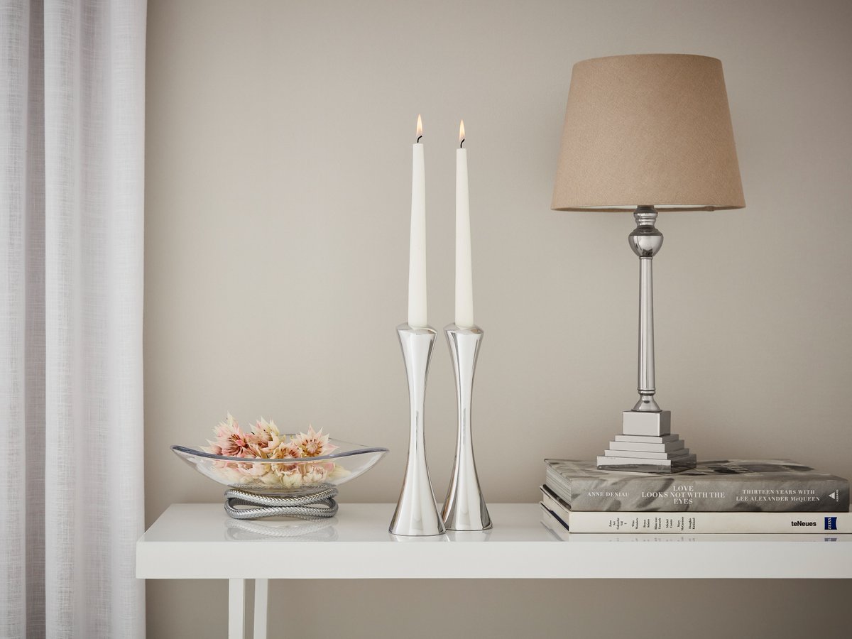 nambe's tweet photo. What's out: gold and brass tones. What's in: #alloy accents. 2023 is all about cool, silver tones making a statement in the home. Experiment with your #decor with #myNambe alloy #candlestickers, centerpiece bowls, and more. Shop décor: https://t.co/b2jltJEXnJ https://t.co/DDiDw1xFUo