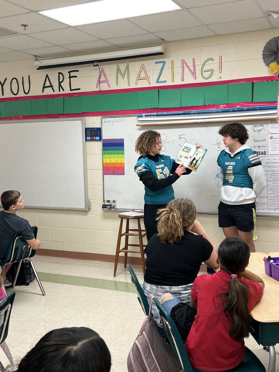 Proud2BeAtPride's tweet photo. Our students took a “Deep Dive Into Literacy” when guest readers from Pine Ridge HS read a book to every class. Thank you Pine Ridge HS! Pride students finished Literacy Week off with a Vocabulary and Storybook parade💙💚 #VCS #vcs123 #Prideelementary #Proud2beatPride https://t.co/ENr2JKOI9j