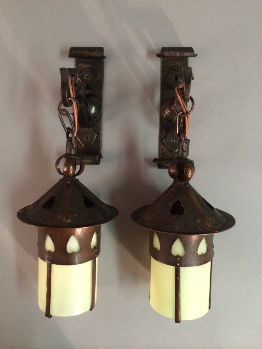 Inspire your heart with art day #Inspireyourheartwithart day! The heart-shaped cutouts on these sconces create harmony and visual interest as they repeat around the cylinder and on the top of the fixtures. 
#MAACM
#museumaacm
#artsandcraftsmovement