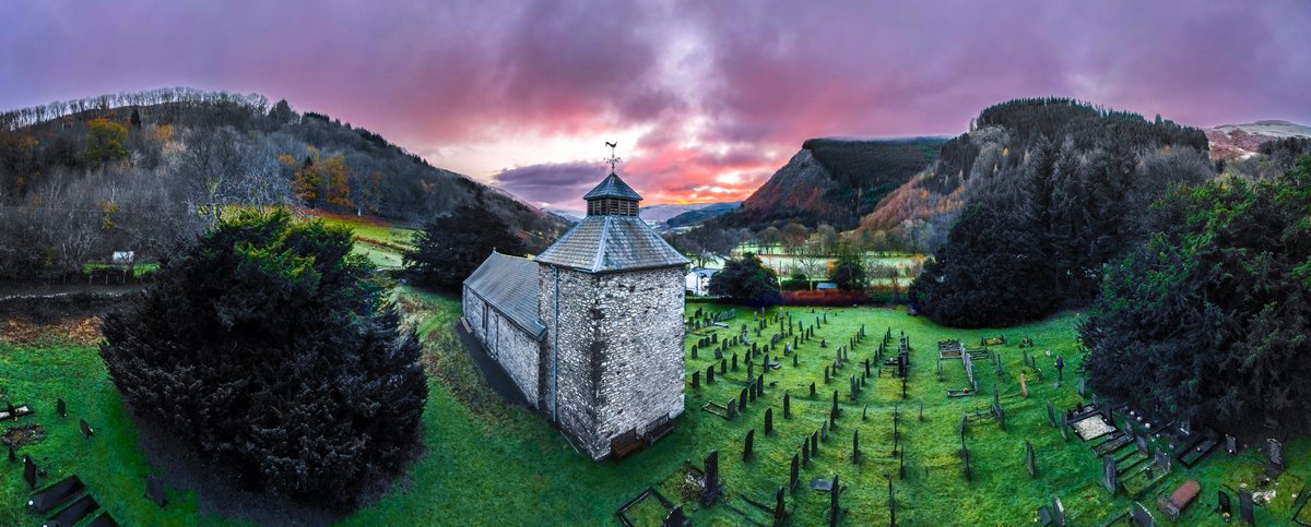 St. Melangell, tucked into the Berwyn Mountains in Powys, Wales sits within an older circular churchyard of ancient origin. Some of the yew trees there are 2000 years old.