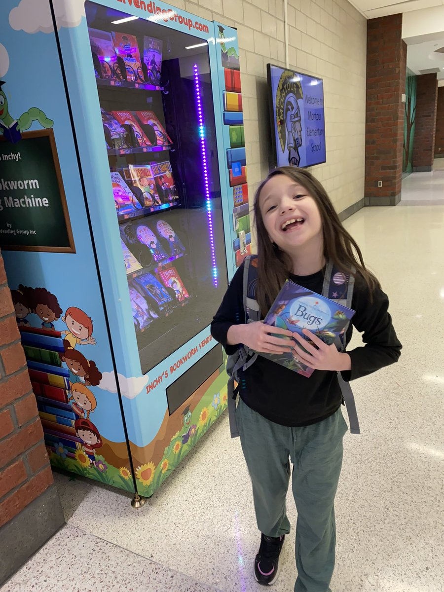 big smiles for earning a gold coin for the book vending machine! #montourproud