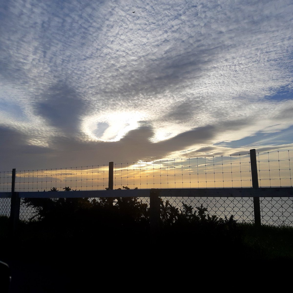 MummaRuth's tweet photo. I tried to capture an angel cloud on the way into work this morning. Unfortunately, by the time I had manage to pull in on the cliff top, one of the 'wings' had dissipated a little. 
Beautiful nevertheless
#angel #angelcloud #angelwings #clouds #cloudphotography #bournemouth https://t.co/echA9gaeMX
