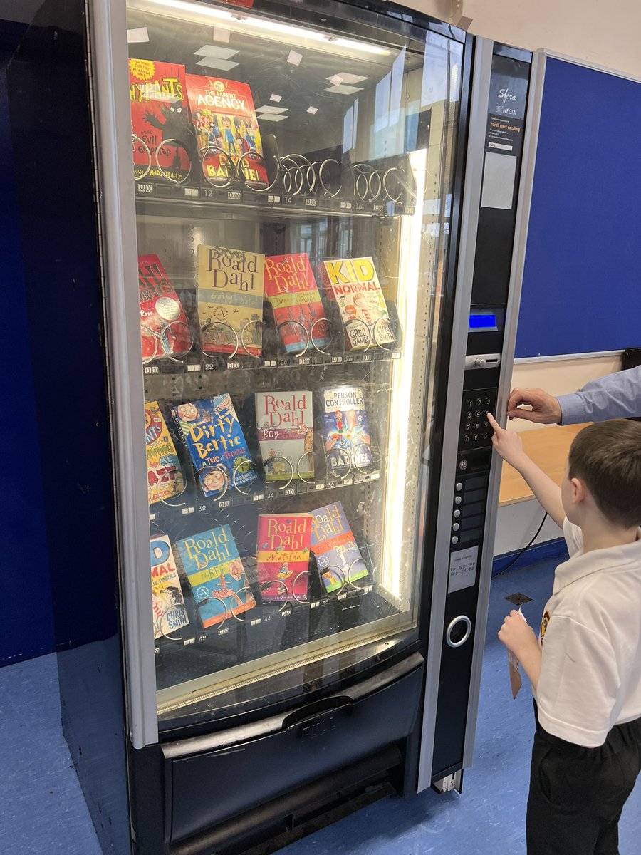 StPPPrimary's tweet photo. Well done to last weekβs top readers! Alfie and Harry were awarded their second βbugβ and traded it in for a golden token. Here they are spending it at the Reading Machine ππ @northwestvend #readingstars #readeroftheweek https://t.co/OaMrvPWI3v