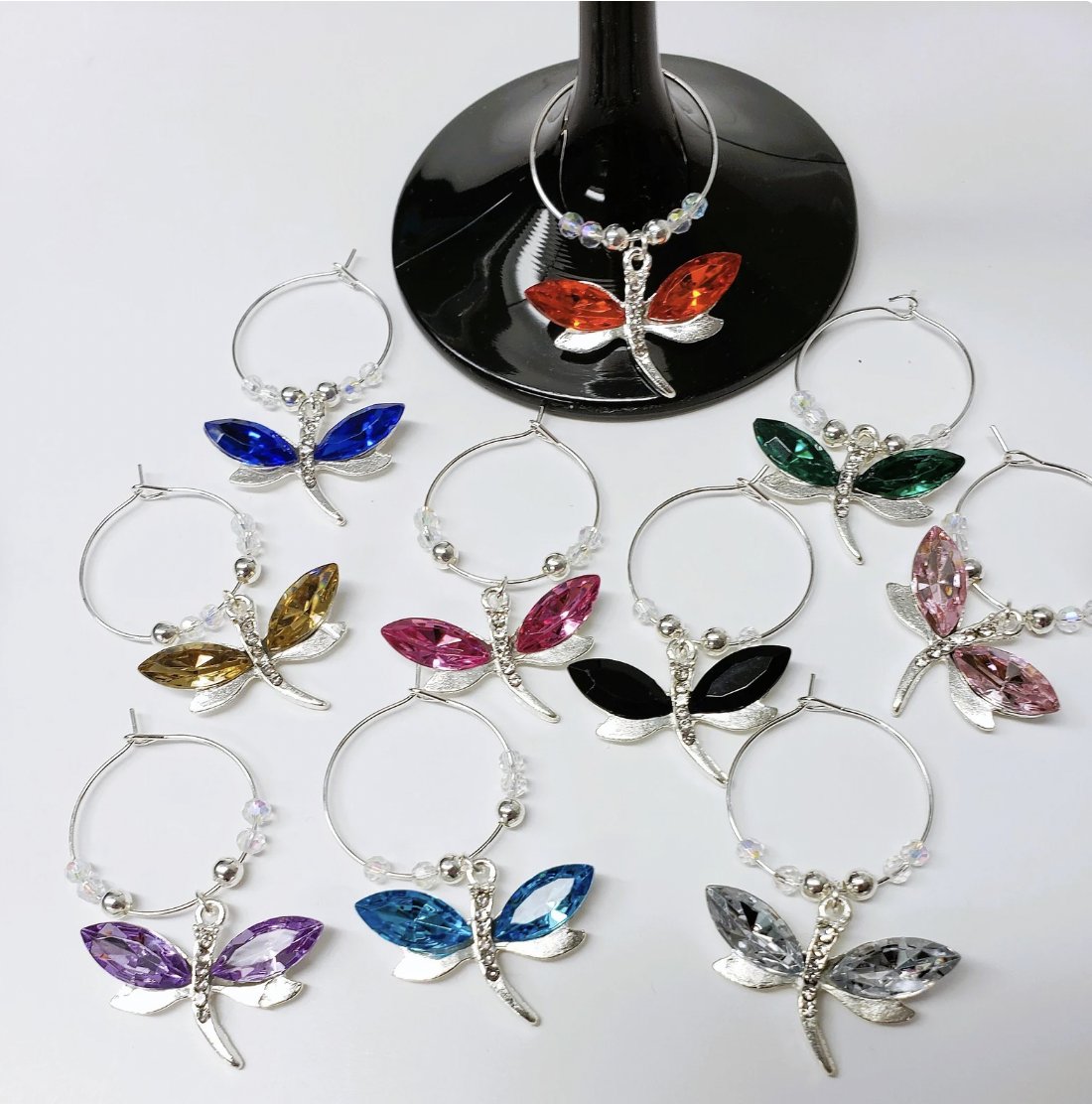 Dragonflies & Crystal Wine Charms, Set of 10 Drink Markers in multi color #easylifeinspirations #crystalwinecharms #dragonflydrinkmarkers #setoftenwineglasstags #multicolorglassmarkers #uniquegifting #shopsmallonline  bit.ly/3WOde39