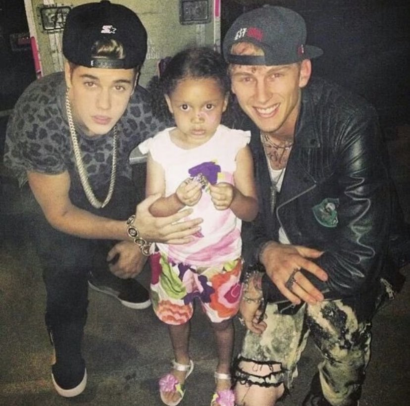 Machine Gun Kelly with Casie and Justin Bieber.