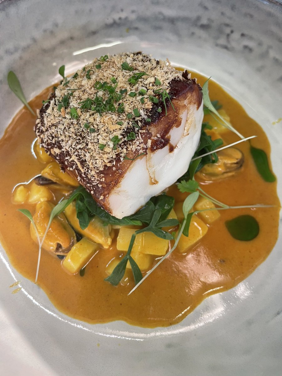 Baked cod, tamarind glaze, spiced crumb, Goan curry sauce, ratte potato &amp; smoked mussels- new dish.