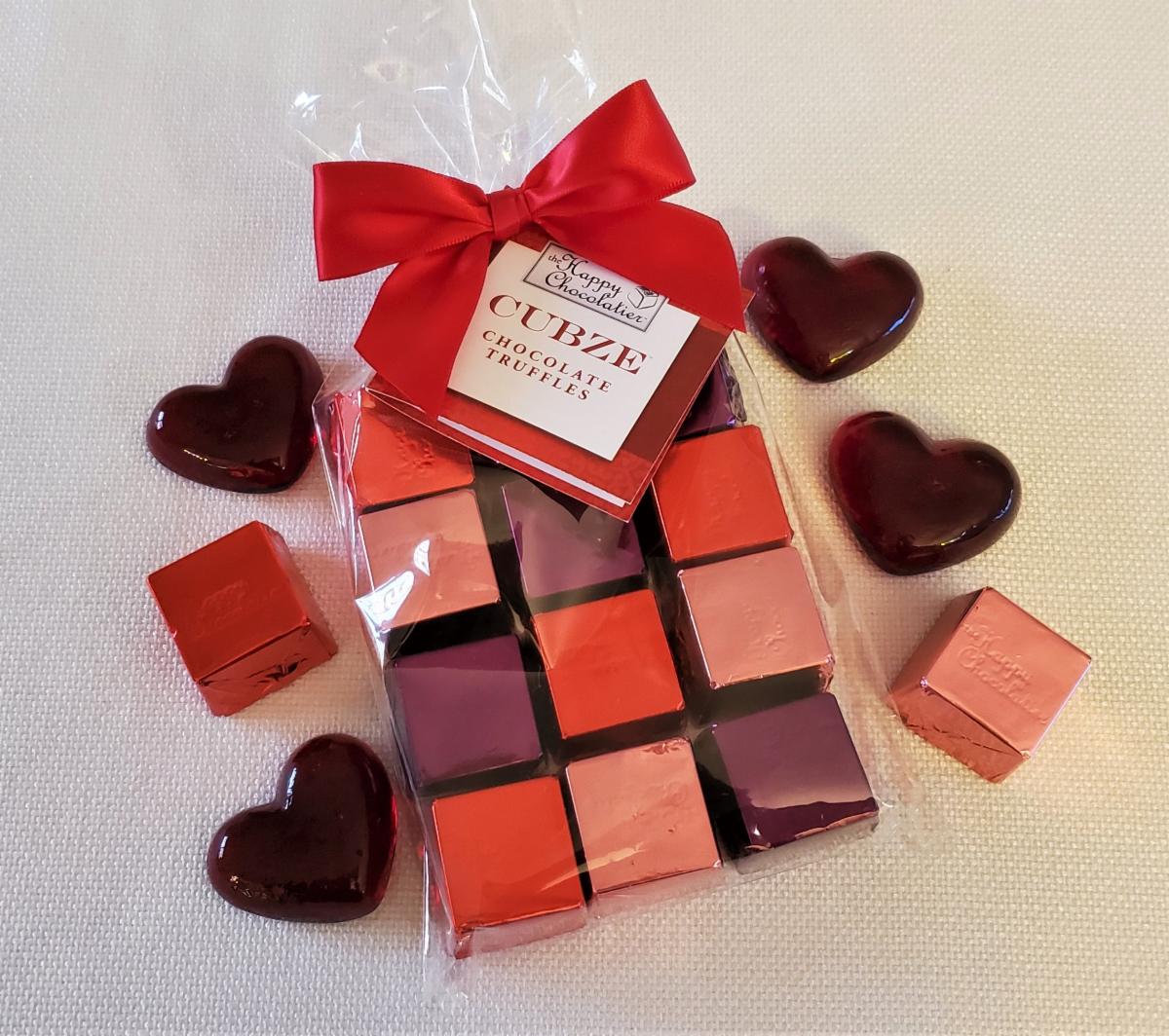 This 12-piece bag makes a great Valentine's Day gift! Includes orange, raspberry and cappuccino Cubze in Valentines-y colors. 🥰 Order today at thehappychocolatier.com

#valentinesday #chocolate #chocolatetruffles #valentine #bemine #spreadchocolatehappiness