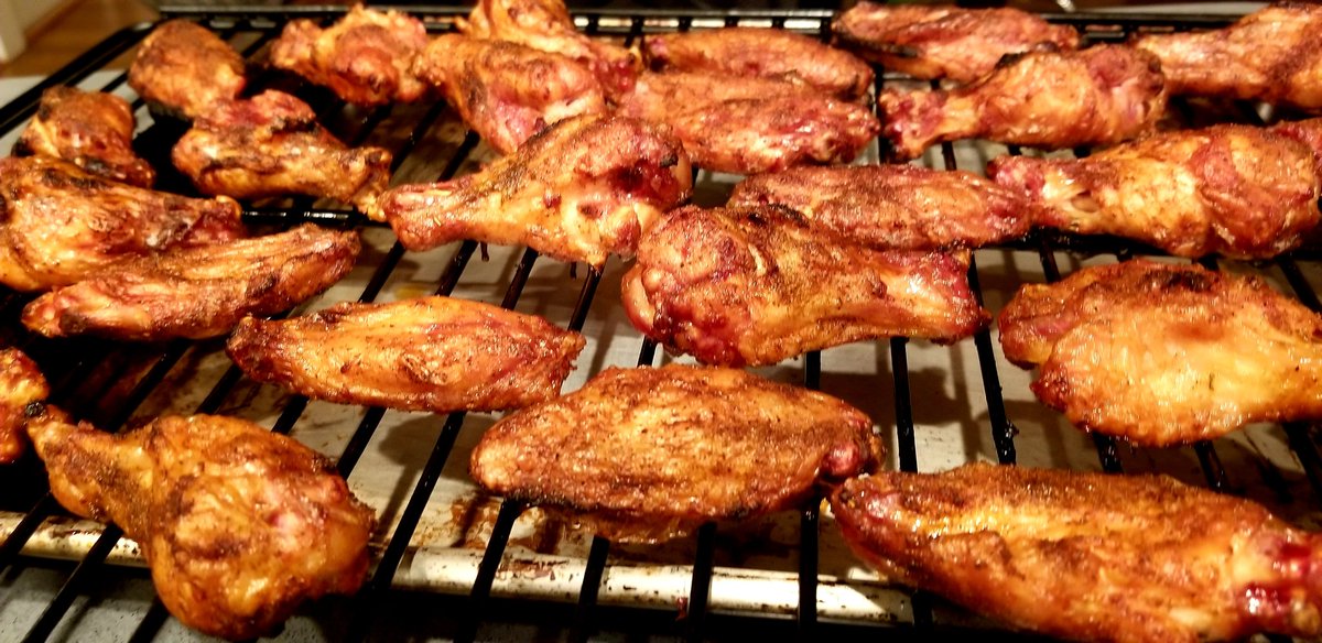 Crispiest ever. Rub is salt, pepper, poultry seasoning, celery salt, and a teaspoon of corn starch. Dusted on both sides with a spice bottle.  Smoke at 225 for 30 minutes.  Increase heat to 400 until crispy brown.  Tossed in Frank's with a melted pat of Kerrygold butter.