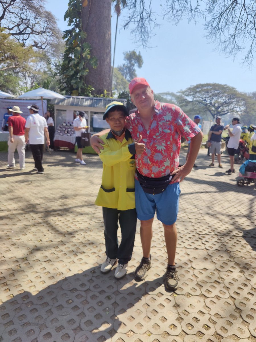 CambodianDisc's tweet photo. Me and my caddy from Chiang Mai Open in Thailand. The disc golf course is on a ball golf course so the golf caddies are out of work for the weekend. The td of the CMO suggested we have them caddy for us. They were legends. Especially Tom. https://t.co/rdSeOb9rsW