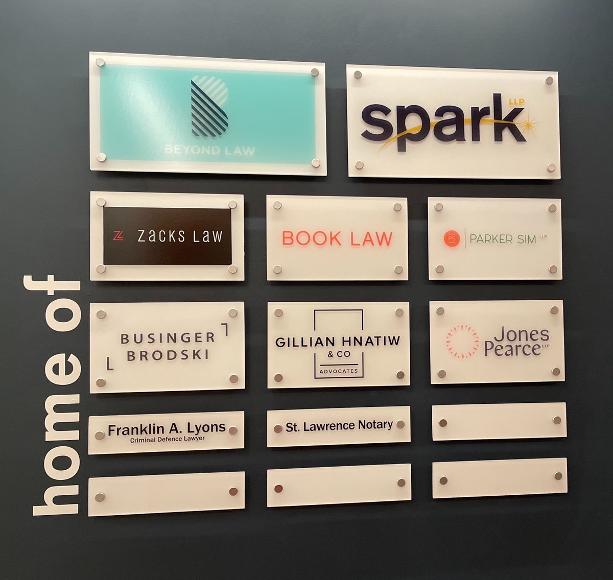 Check out our sweet new Jones Pearce sign at the office!  And among such great company