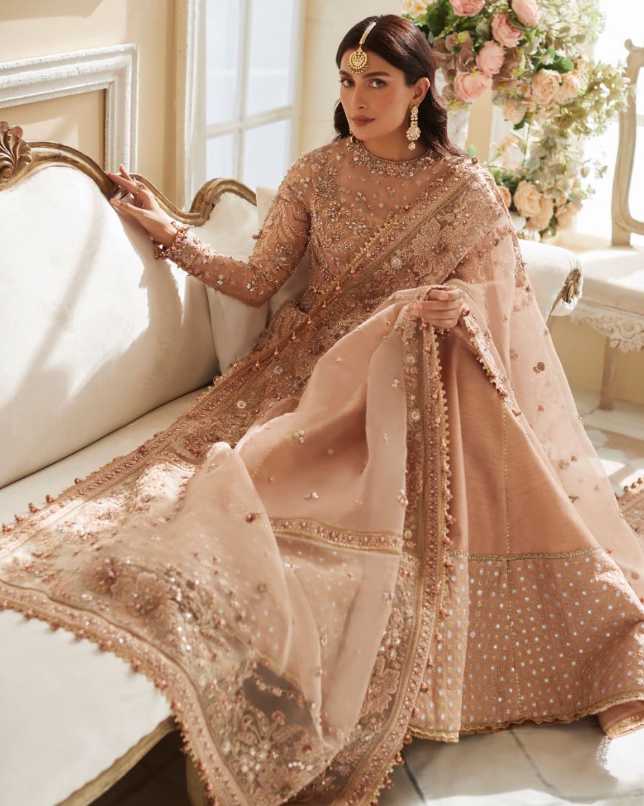 Pakistan’s favourite actress, <a href="/Ayezakhanak3/">Ayezakhan.ak</a>, steps in the world of glamour with ‘Ariana’ - a stunning design from Élan’s new wedding festive collection.  
Laden with iridescent embellishments, this masterpiece exudes a timeless charm that’s sure to turn heads.