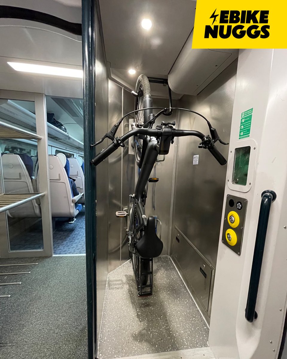 EbikeNuggs's tweet photo. Not a huge fan of this style of bike storage on trains. Even for someone able-bodied, it’s a challenge to get even quite a light #ebike up onto these hooks. #ActiveTravel #MultimodalTravel https://t.co/tE9nNpp3GQ