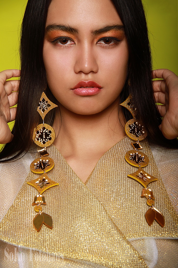 Hinauri showcasing stunning outfit by Heather Bouchier and earrings from Indi City by Angel Aubichon and Alex Manitopyes.  #indigenousfashion #womenswear #portraits #portraitphotography #yegfashion #canadianfashion