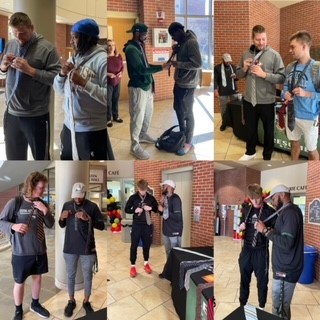 CMUCareerCenter's tweet photo. Huge shoutout to @cmusctf Coach Kenny Anderson and his assistant, Tevin Riddle, and @cmu_mbb assistant, Bryan Adams, along  with VP for Student Life Brad Dixon (not pictured) for helping 63 young people learn the life skill of tying a tie today. #CareerReady #CMUEagles #Coaches https://t.co/5BoifLfW39