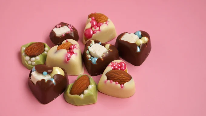 Heart-shaped chocolate candy with almonds