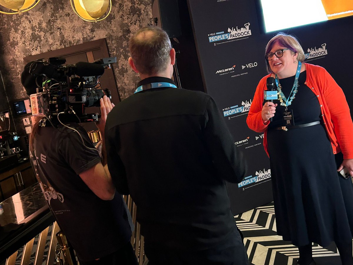 Sareyware's tweet photo. Some photos that Simon took of me chatting to the camera about my love of @McLarenF1 at the #velopeoplespaddock event last night. I look like Iโm singing in those last two! ๐คฃ๐ค๐งก https://t.co/hcgdXB81W7