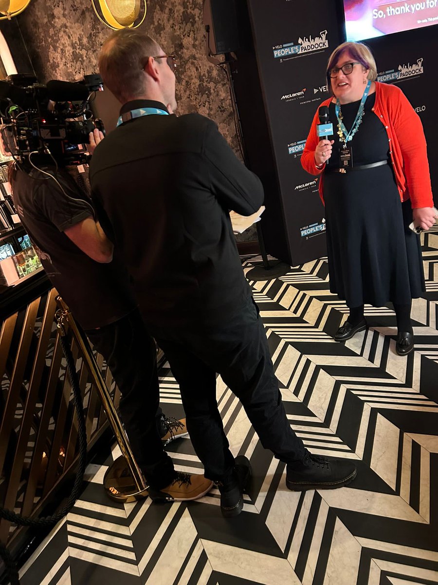 Sareyware's tweet photo. Some photos that Simon took of me chatting to the camera about my love of @McLarenF1 at the #velopeoplespaddock event last night. I look like Iโm singing in those last two! ๐คฃ๐ค๐งก https://t.co/hcgdXB81W7