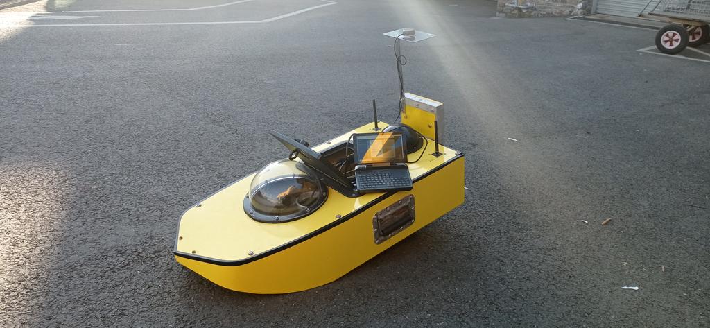 OfficialSWCM's tweet photo. Prepping USV Yellow Tin for deployment next week, for our Spring Interim surveys. Currently running some firmware updates, fingers crossed it runs smoothly... 🤞#USV #CoastalMonitoring #SingleBeam https://t.co/0zV0RATcEV