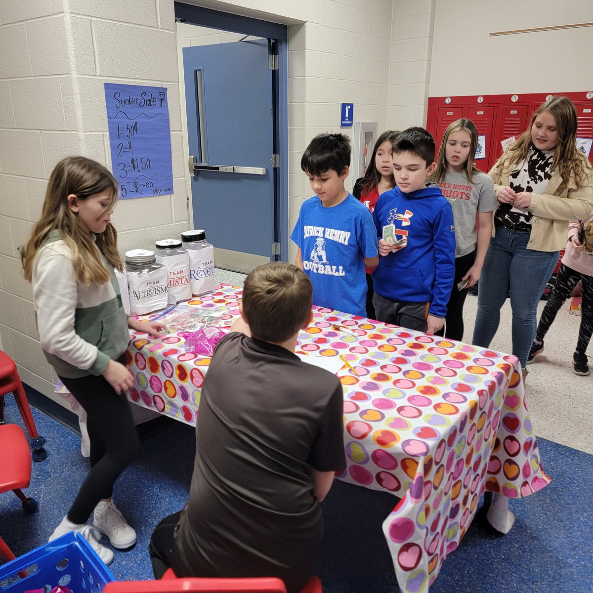 karleykay11's tweet photo. 4th grade is hard at work during their sucker sale for Skylar.  They even had lineup! 💗💙 #phstrong #skylarstrong https://t.co/10dA1tHYGv