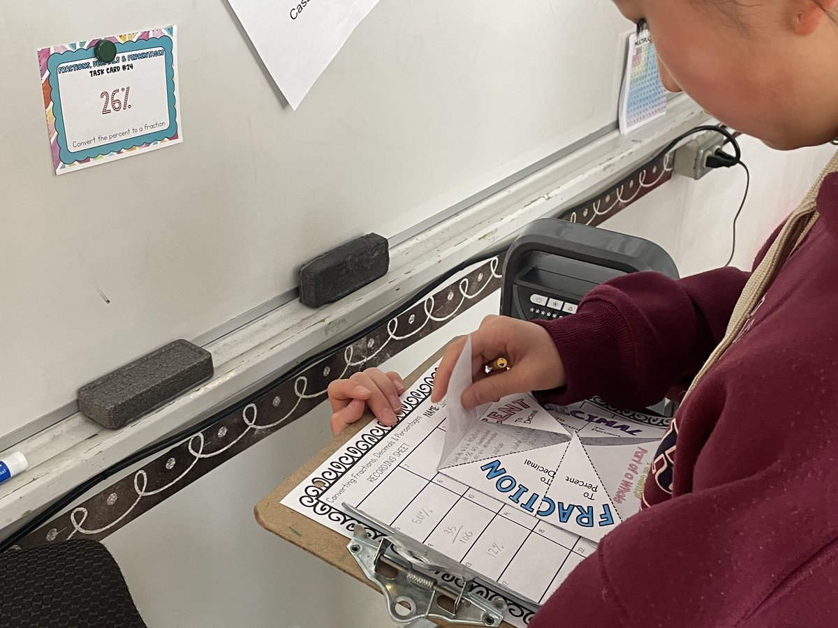 HuttonAltadore's tweet photo. Why do math at our desks when Ms H can hide questions all around the classroom?!? Practicing converting fractions, decimals, and percents. https://t.co/Nr49LeVYkP