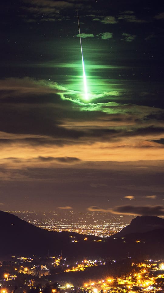 Once in a lifetime shot. A brilliant green meteor lights up the sky over Southern India. Credit: Prasenjeet Yadav