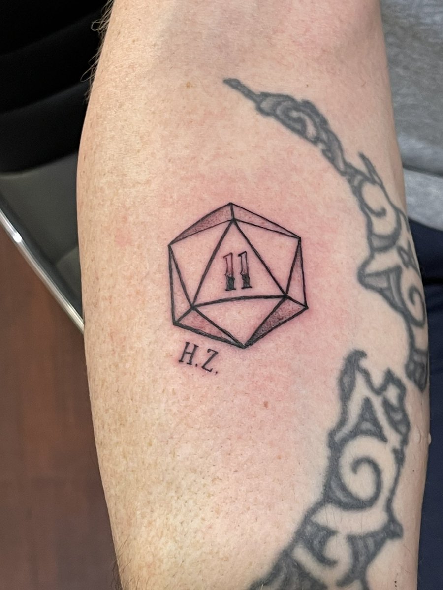 albanjf's tweet photo. When a series of events lead you to naming your DnD character Henry Zebrowski… and then you end up with his initials tattooed on your arm.. @HenryLovesYou https://t.co/vbMtoHuUcf