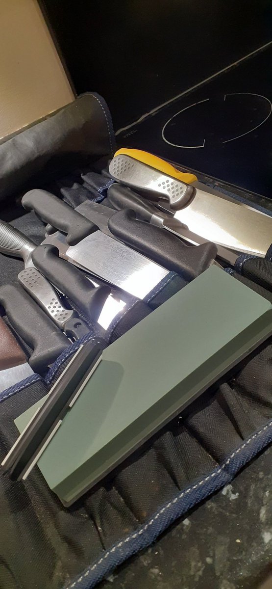 pipsy80's tweet photo. Yesss got myself a nice new sharpening stone to play with 🔪
A lovely early birthday gift from the workies 🤩
So of course I had to bring all the knives home from work 😂😂 
#SchoolCook
#toolsofthetrade https://t.co/YbNC5Oj8dc