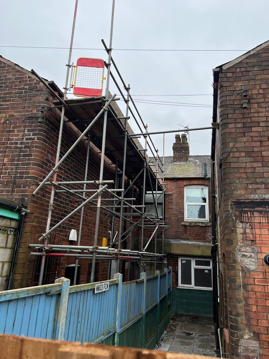 Double shop front and double scaffold at the rear on 2 out riggers. 
 All for new roof.