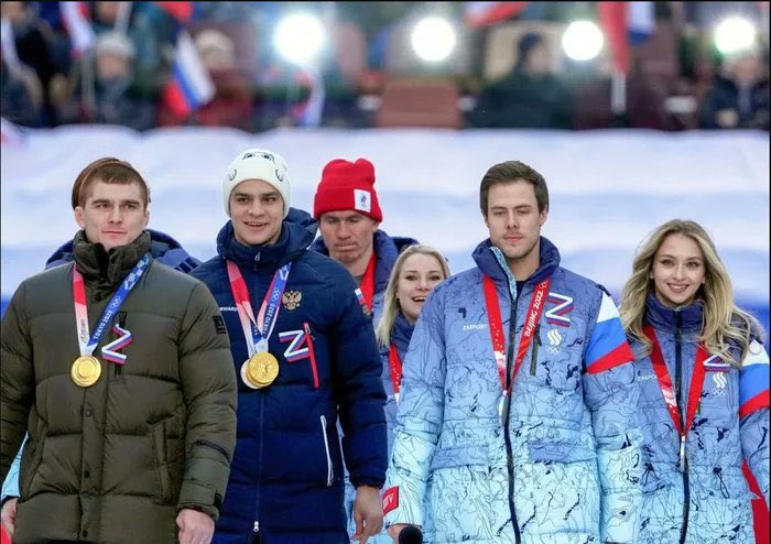 KhaterDiana's tweet photo. Is @iocmedia @Olympics going to allow these genocide supporters to participate as well? Do you see those Olympic rings on their necks? Are you proud to see them near the symbol that is used by russian occupiers who kill, rape and torture innocent people? https://t.co/5MMOp32i6P