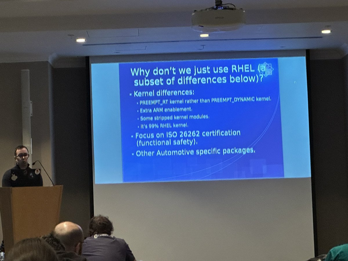 JenInnovate's tweet photo. .@ericcurtin17 reviews work within the @CentOS #Automotive SIG and discusses the differences between @RHEL and #RHIVOS (Red Hat In-Vehicle Operating System.) #brussels @redhatopen #RedHat #opensource #linux https://t.co/fmj4LvfEHf