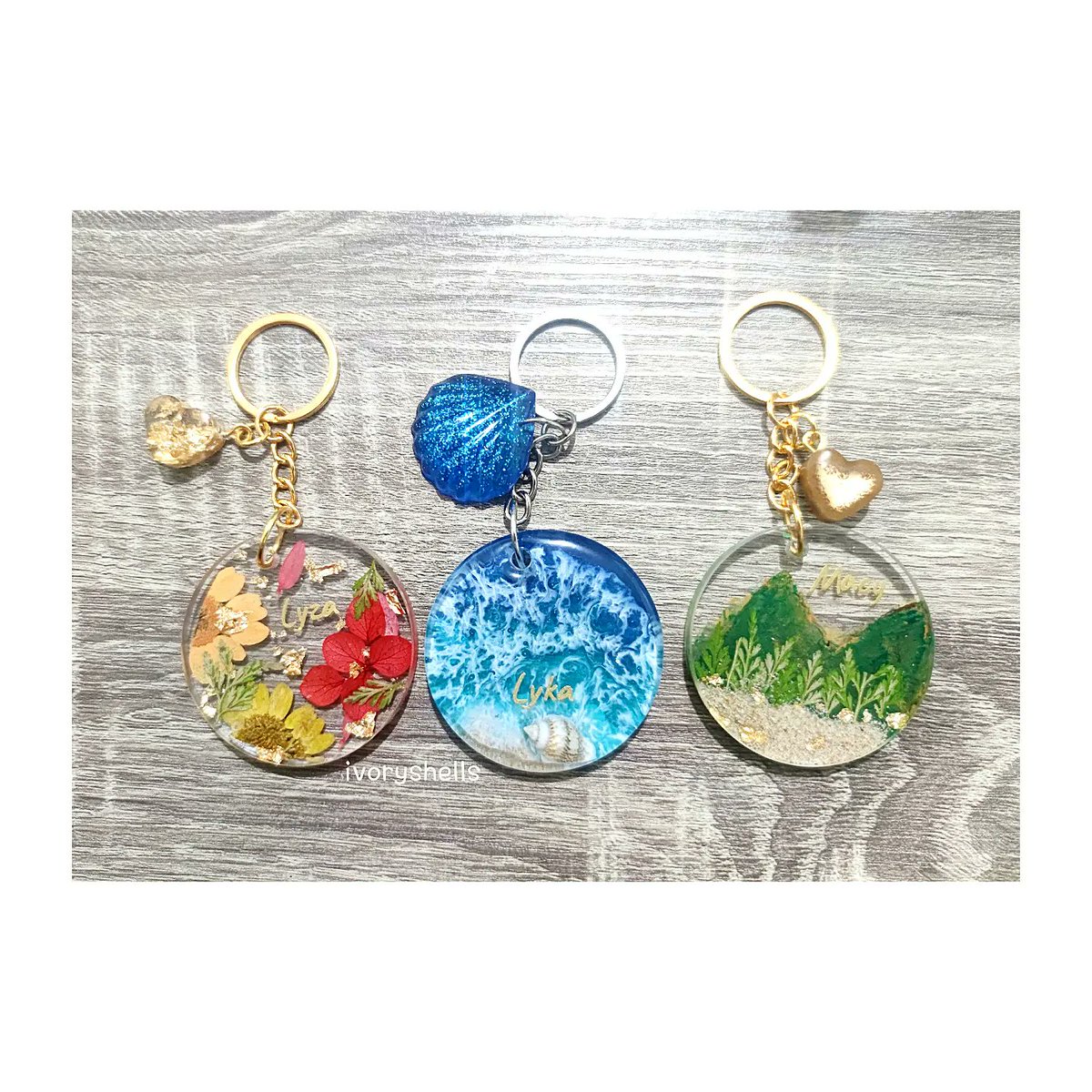 GaringKabibii's tweet photo. A sister's gift to her siblings. ❤️

One that loves the sea, another that loves Autumn, and the third one that loves to go on hikes. ❤️💙💚

#resinart #handmade #handmadeph #resinartistph  #customArt
#keychains #keychainsph
#resinKeychain  #giftideas https://t.co/6PVDUEJedf