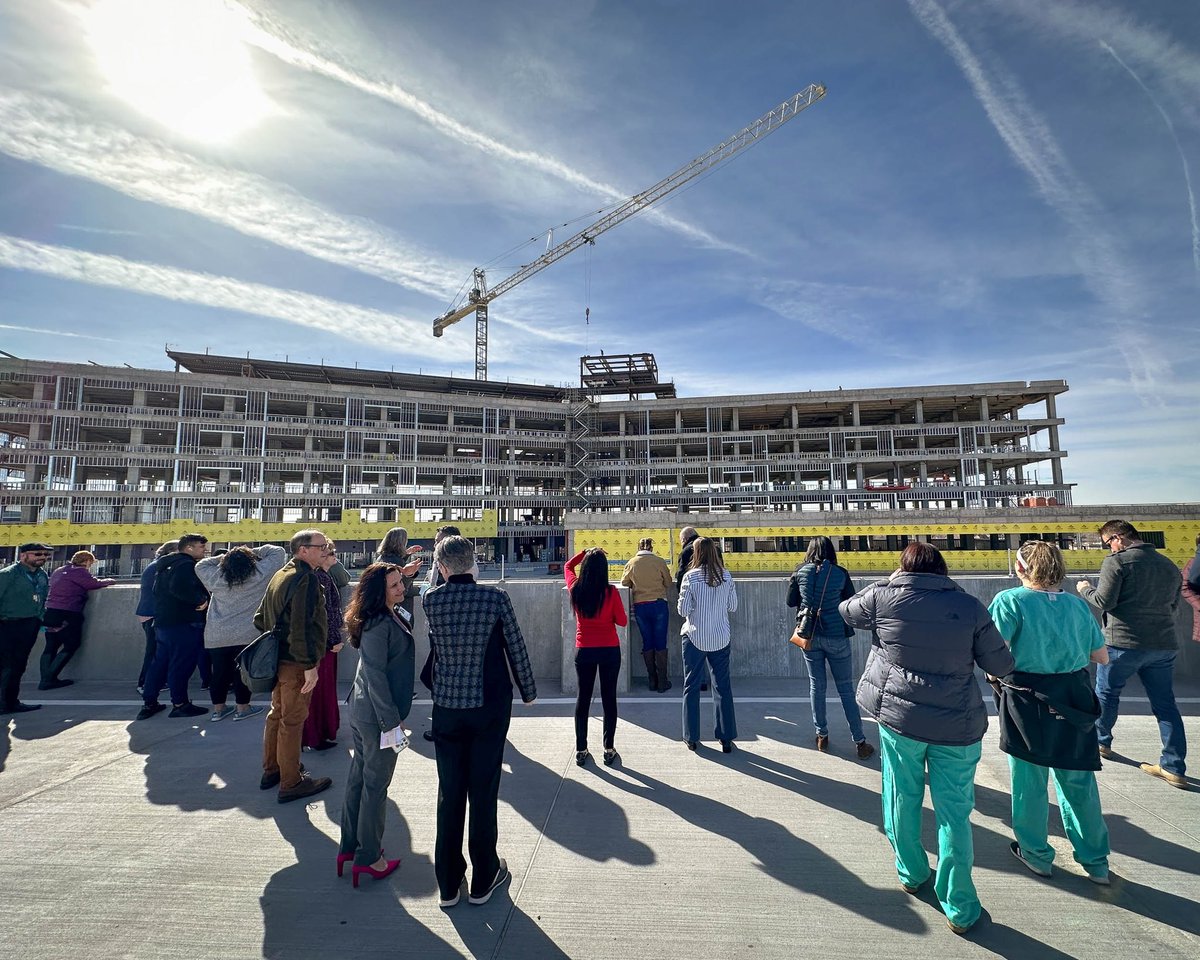 UNMHospital's tweet photo. This morning, the construction crews placed the final beam on the UNMH Critical Care Tower. We’re excited to see this state-of-the-art healthcare facility take shape and begin serving the New Mexico community in 2024. https://t.co/6MfJODAnSJ

#BuildingMoreForNM #DeliveringMore https://t.co/SVf4F1Un0A