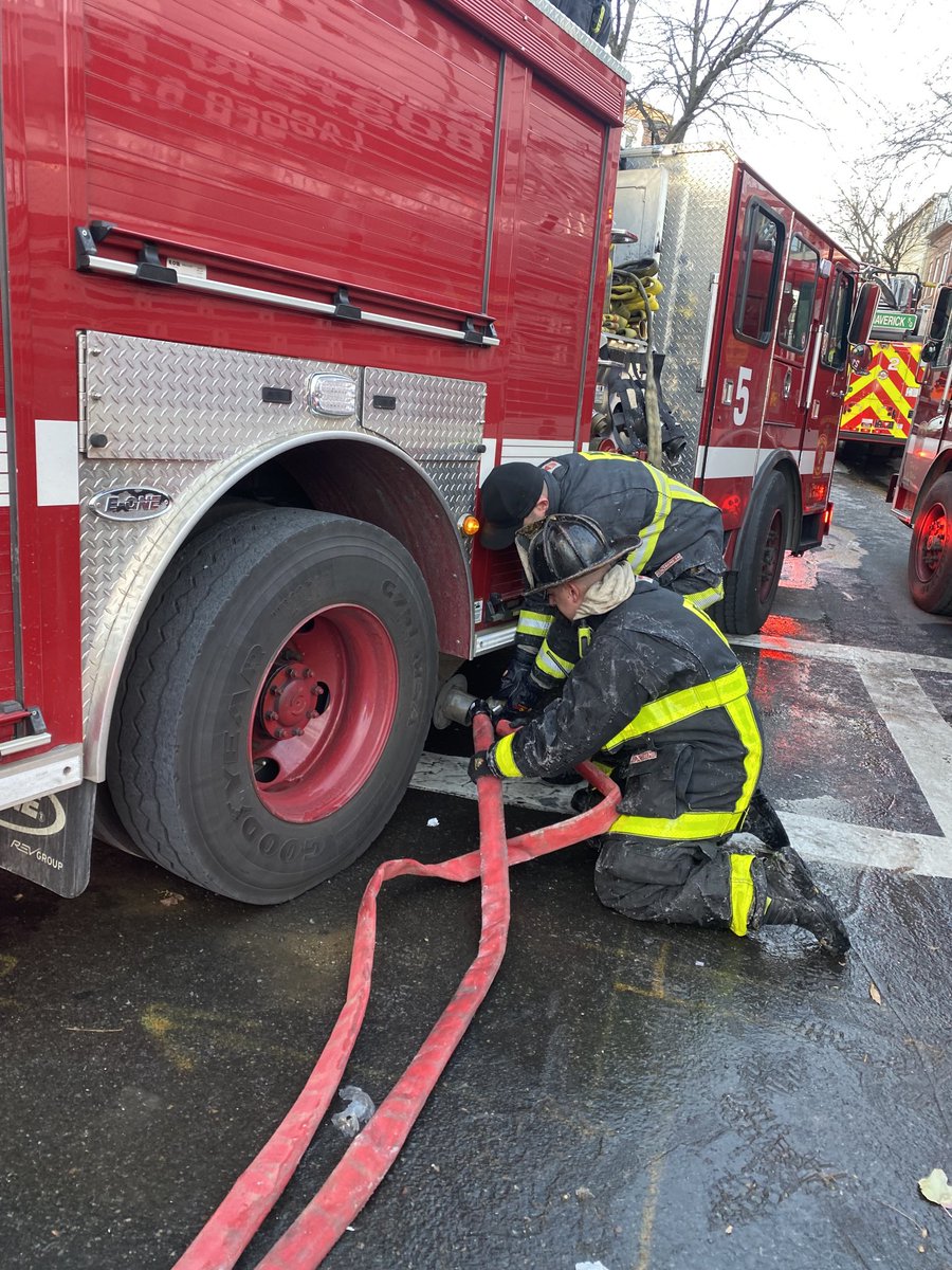 BostonFire's tweet photo. The fire is out and companies are making up, but they are still dealing with slippery conditions and frozen hose couplings as well as the extreme temperatures. https://t.co/Y97uO8iDZe