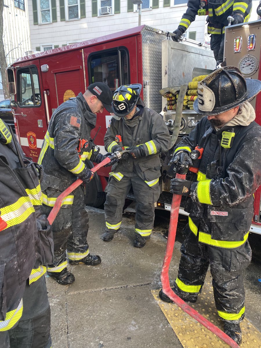 BostonFire's tweet photo. The fire is out and companies are making up, but they are still dealing with slippery conditions and frozen hose couplings as well as the extreme temperatures. https://t.co/Y97uO8iDZe