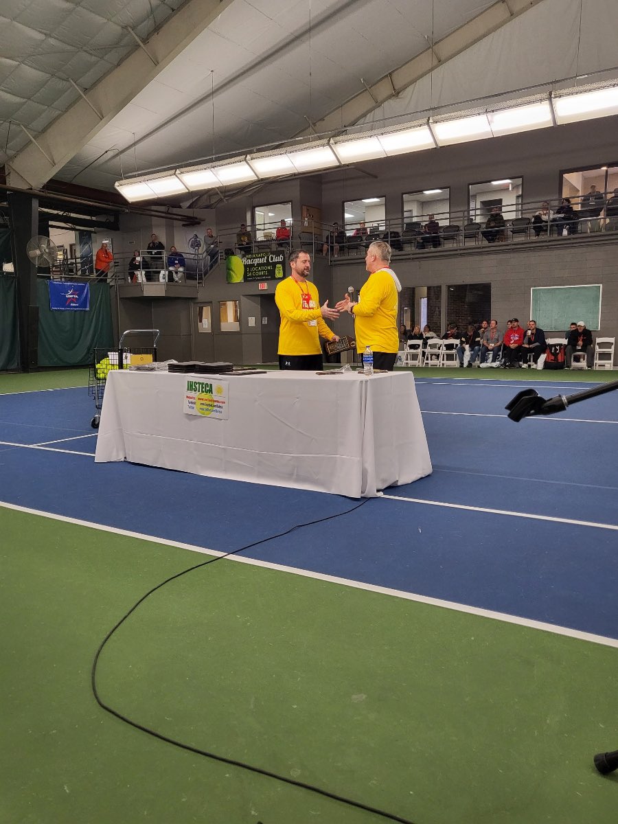AMHSTennis's tweet photo. 2023 Indiana Tennis Convention where Coach DeVault receiving his 2022 District 4 Coach of the Year Award from fellow IHSTECA Officer Gabe Muterspaugh. https://t.co/3LCzkIA8N2