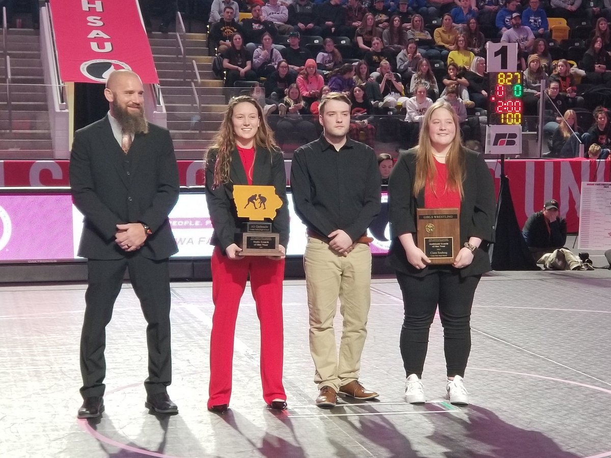 Cedar Falls head coach Ali Gerbracht receives her IWCOA Girls Coach of the Year award before tonight's final session of girls state wrestling. Gerbracht is an AGWSR grad and 2019 IWCOA girls state champion. #iahswr