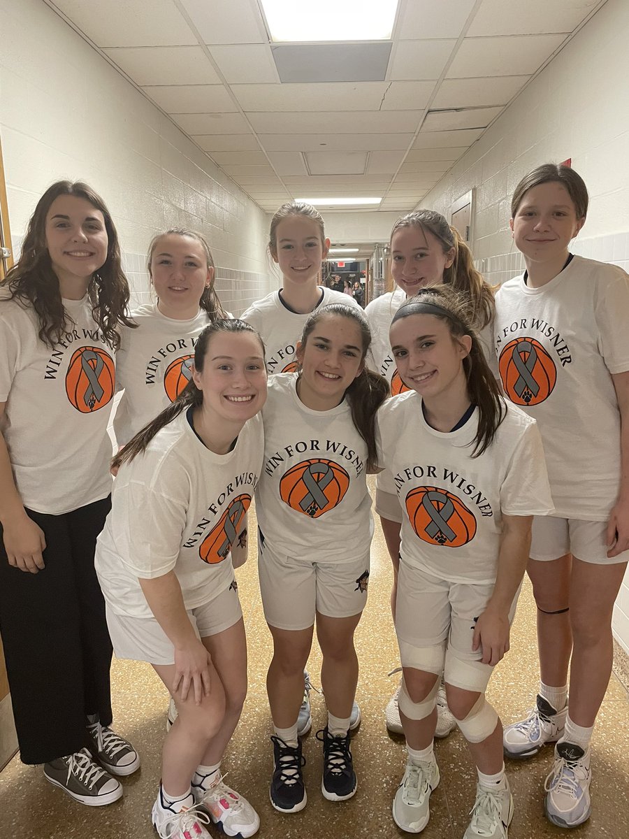 Lady Colonials getting ready to take on CY in the season finale showing their support for Coach Wisner!