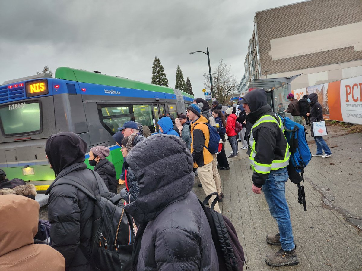 Agazy_Mengesha's tweet photo. Fun times: its rainy, windy, and the Oakridge line to waterfront is unavailable because of a police emergency so we're lining up in droves for the bus. https://t.co/pHmizGttda