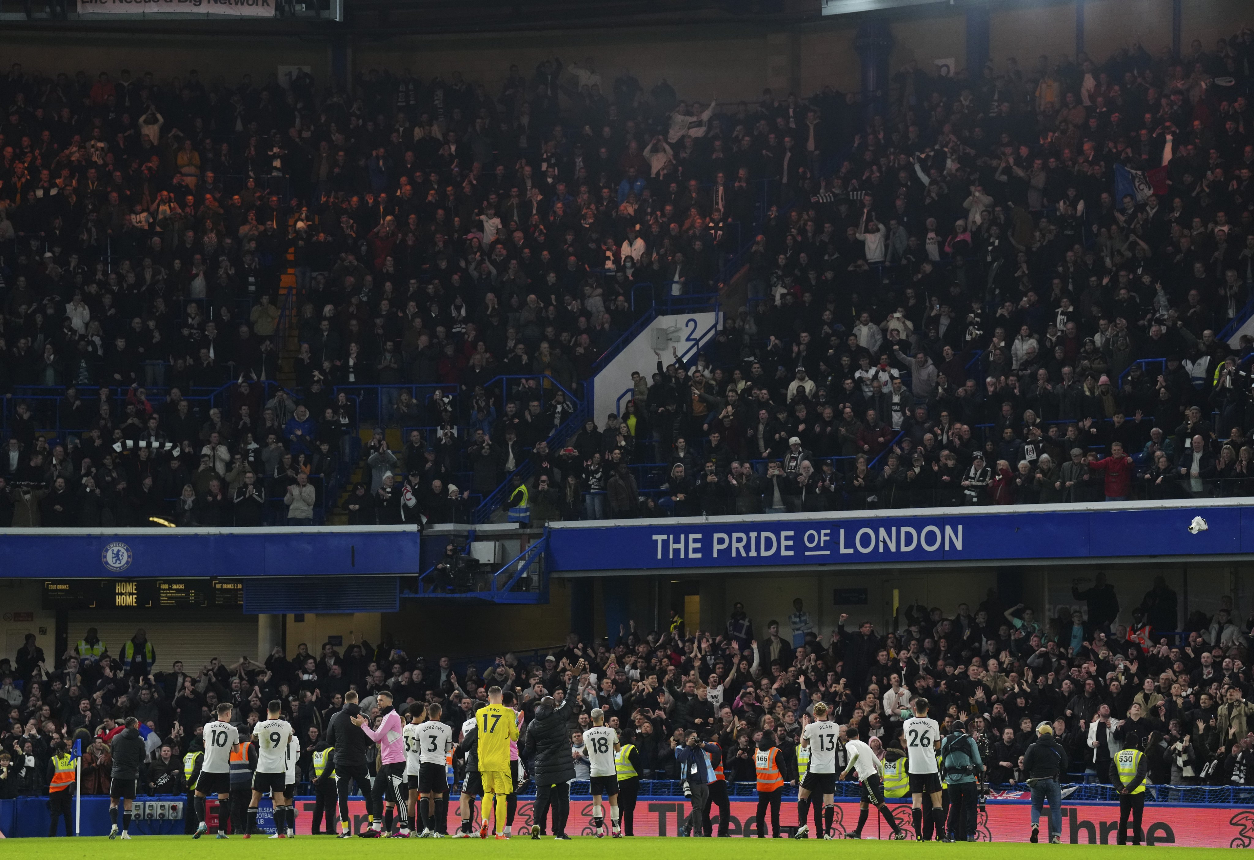 The Fulham players applaud the away end at full-time.