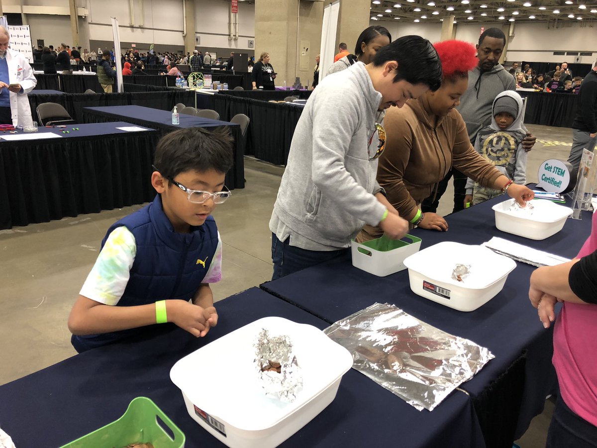 Parents getting in the action building boats at the Dallas ISD STEM Expo!!!  Son beat dad by the way!  His boat held more pennies! <a href="/DallasisdSTEM/">Dallas ISD STEM</a> <a href="/DallasISDSupt/">Dr. Stephanie S. Elizalde</a> <a href="/Johnson4Dallas/">Mayor Eric L. Johnson</a> <a href="/stej_sanchez/">Stej Sanchez</a> <a href="/STEMscopes/">STEMscopes</a> <a href="/STEMscopesJamie/">Jamie TX STEMscopes</a> <a href="/mcleodl/">Laura Lee McLeod</a>