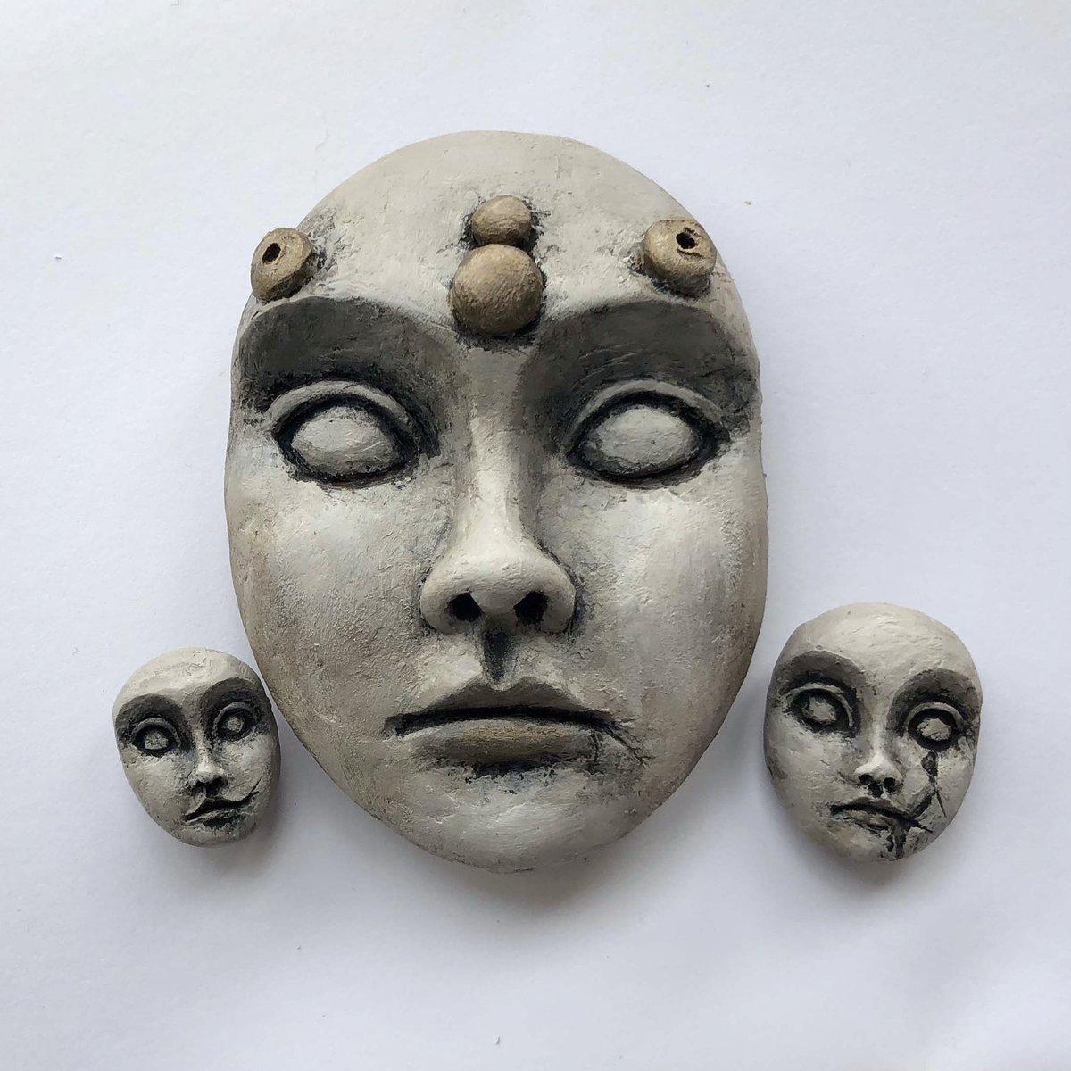 3 different hand-sculpted faces. 

.. 

#polymerclayart #handsculpted #workinprogress #facesculpture #dollheads #dollfaces #spiritdolls #stoicfaces