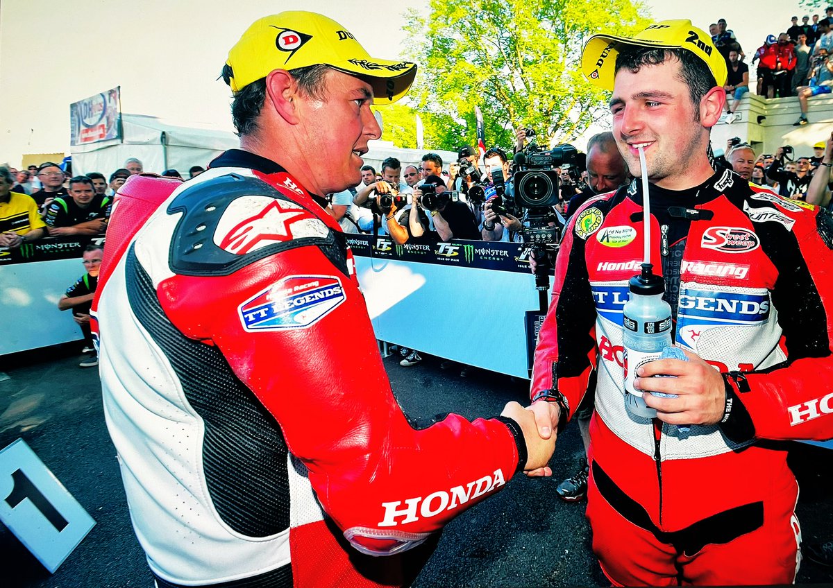 sdbikephoto's tweet photo. Michael’s smile, his cheeky wink and the slightly shell shocked look on John’s face might suggest this handshake was after Michael won the Superbike TT in 2013.But his hat says 2nd and this is the winners enclosure of the Senior. And they say the camera never lies…#graceindefeat https://t.co/DpL2I0mEq1