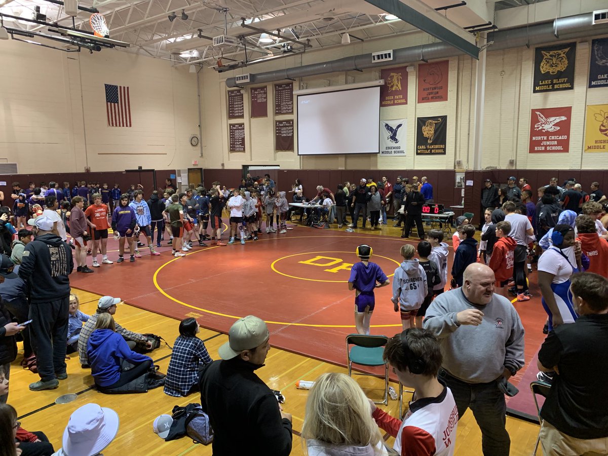 Wrestling tradition. The championship line up hand shake / stare down