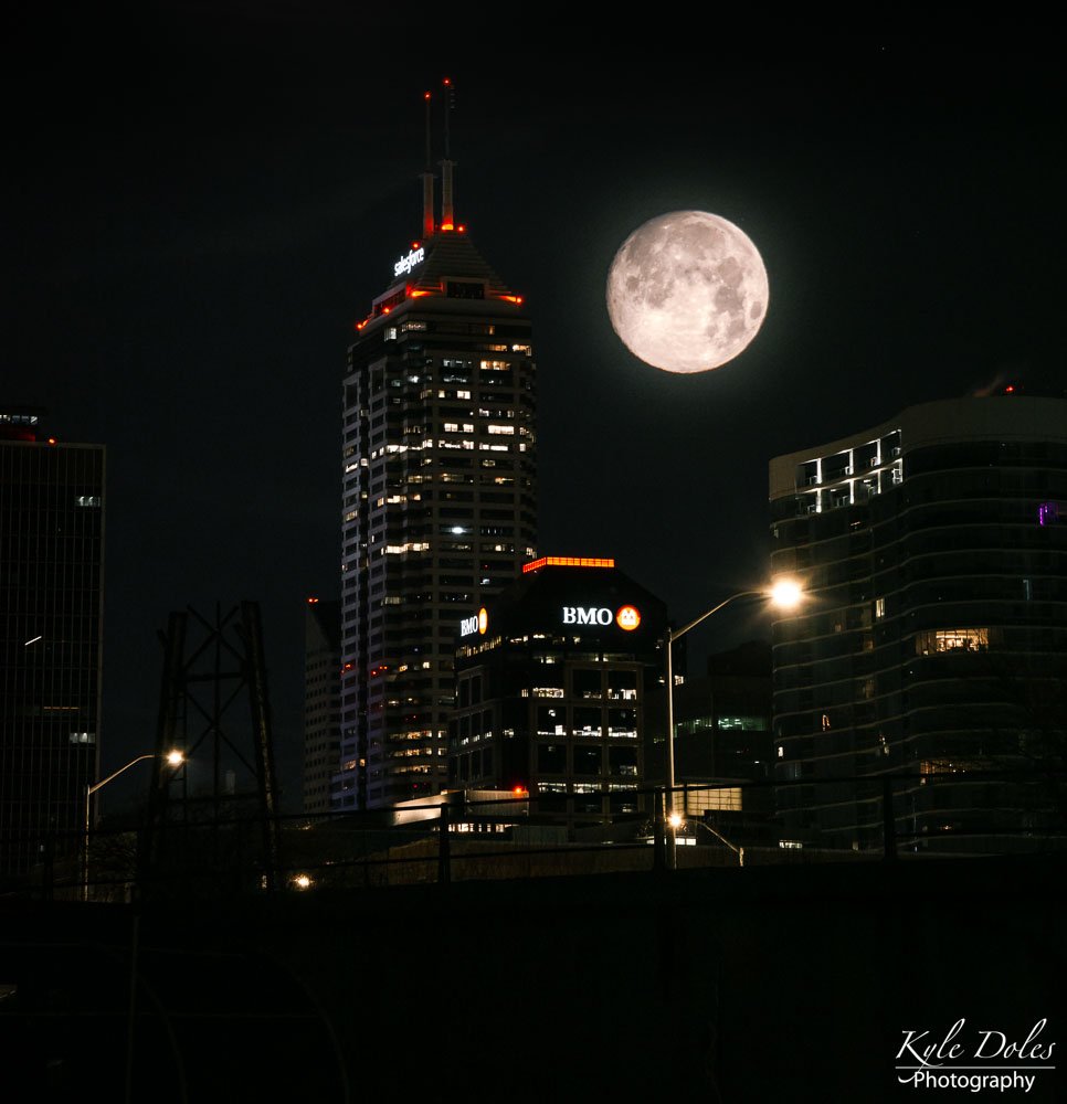 Woke up at 4am.
5° with the wind chill.
Didn't bring enough coffee. 
Got yelled at for being in a parking lot. 
Froze my ass off.
......
Got an awesome double exposure with a full moon. 
Priceless!