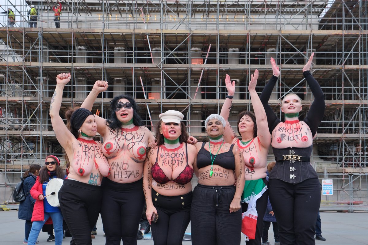 MaryamNamazie's tweet photo. On #HijabDay we said #No2Hijab #BodyRiot against religious &amp; patriarchal norms imposed on women and their bodies with sheer violence. In solidarity with #WomanLifeFreedom in #Iran. #MahsaAmini
@Femen_France @One_Law_for_All @CEMB_forum 
Photos by @EleventhHourPh1 https://t.co/4YHRosxJnb