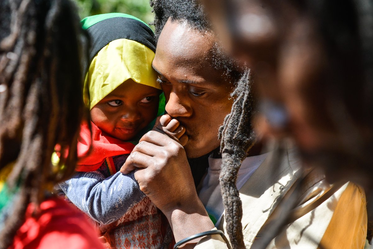 wethankmedia's tweet photo. An adherent of the Rastafari Sect carries a young girl during the group's special prayer for Kenya at Menengai Crater Nakuru. The Nakuru Rastafari community has decried governments decision to introduce GMO crops in Kenya. https://t.co/vA7AnP55ip