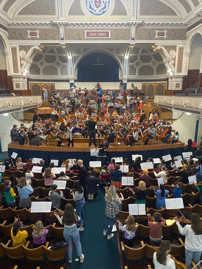 Hello from <a href="/VicHallBMM/">Victoria Hall, Bolton</a>. As The Bolton Sessions come to a close, all 3 of our orchestras have come together to rehearse &amp; perform a unique arrangement for mass string orchestra + improvisation of Bartok’s Romanian Folk Dances No 4-6. <a href="/NickyBenedetti/">Nicola Benedetti</a> <a href="/VictoriaWoodFdn/">Victoria Wood Foundation</a> <a href="/ace_national/">Arts Council England</a>
